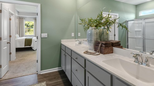 . The primary suite features a step-in 5-foot shower and dual vanity. 4 panel glass sliding doors open onto large covered porch