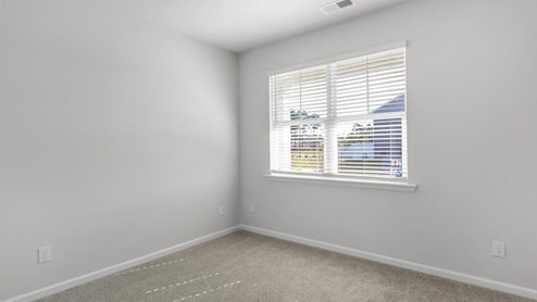 . The primary suite features a step-in 5-foot shower and dual vanity. 4 panel glass sliding doors open onto large covered porch