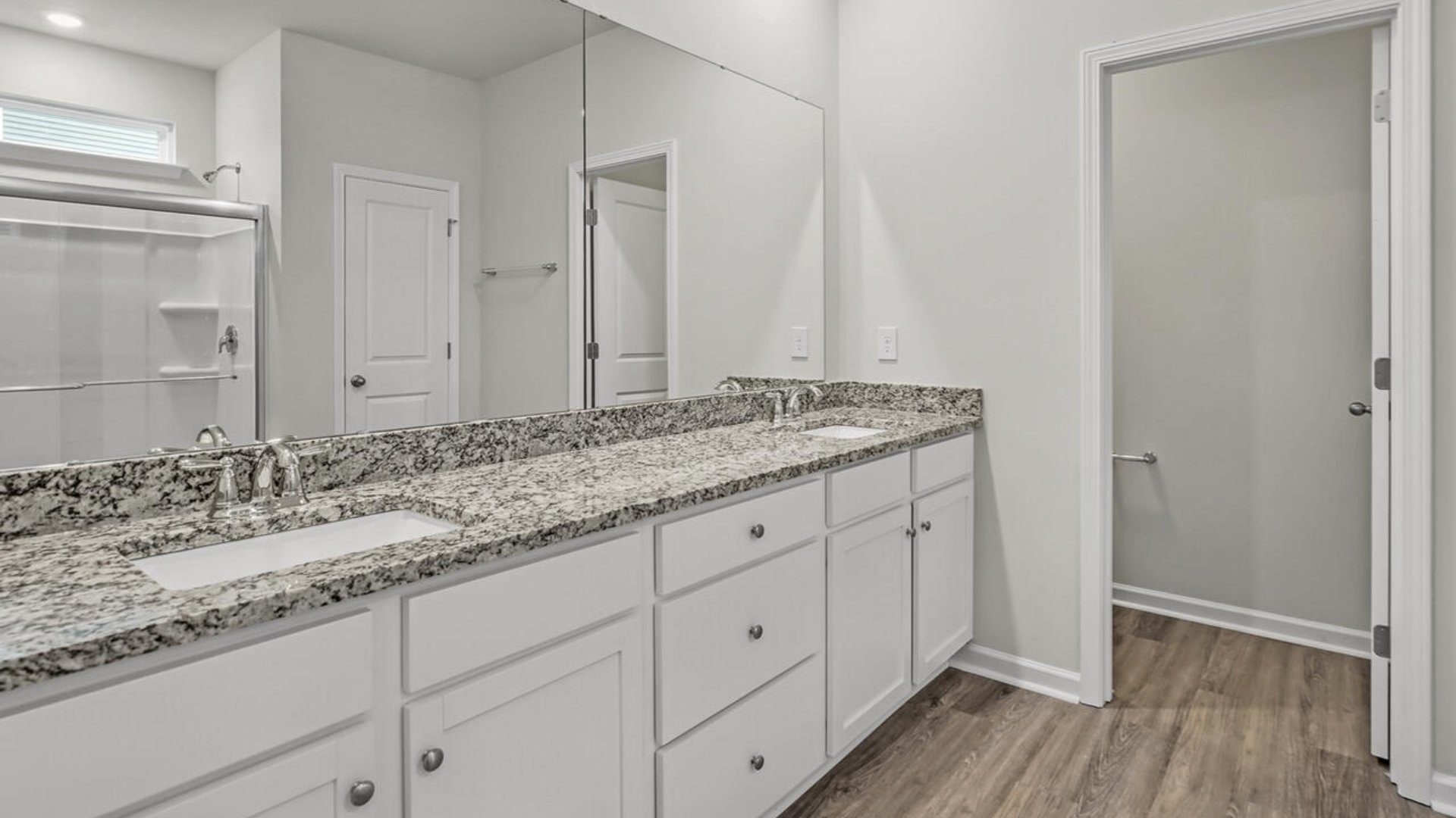 The primary bedroom has its own attached bathroom that features a walk-in closet and all the space you need to get ready in the morning.