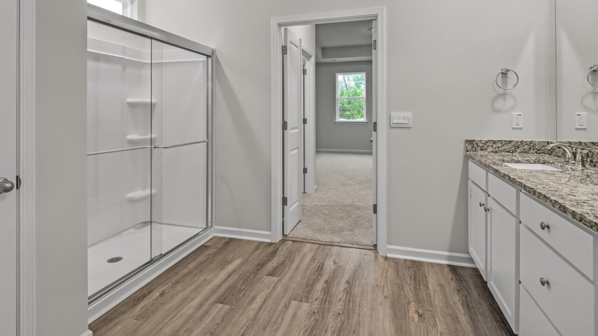 The primary bedroom has its own attached bathroom that features a walk-in closet and all the space you need to get ready in the morning.