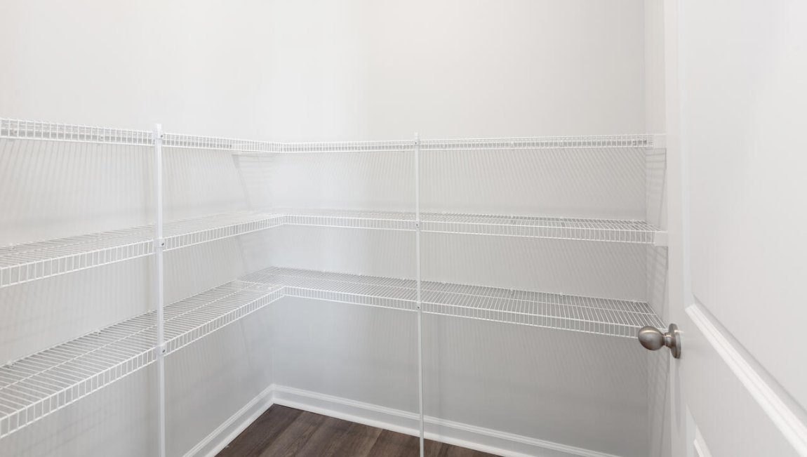 The kitchen features shaker-style cabinets, granite countertops, and stainless-steel appliances, which are sure to both turn heads and make meal prep easy.