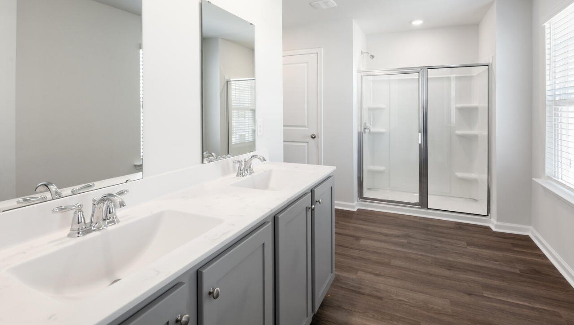 The primary bedroom has its own attached bathroom that features a walk-in closet and all the space you need to get ready in the morning. Sharing a sink isn’t a worry with the double vanity