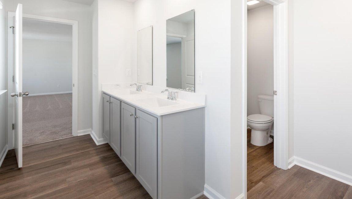 The primary bedroom has its own attached bathroom that features a walk-in closet and all the space you need to get ready in the morning. Sharing a sink isn’t a worry with the double vanity