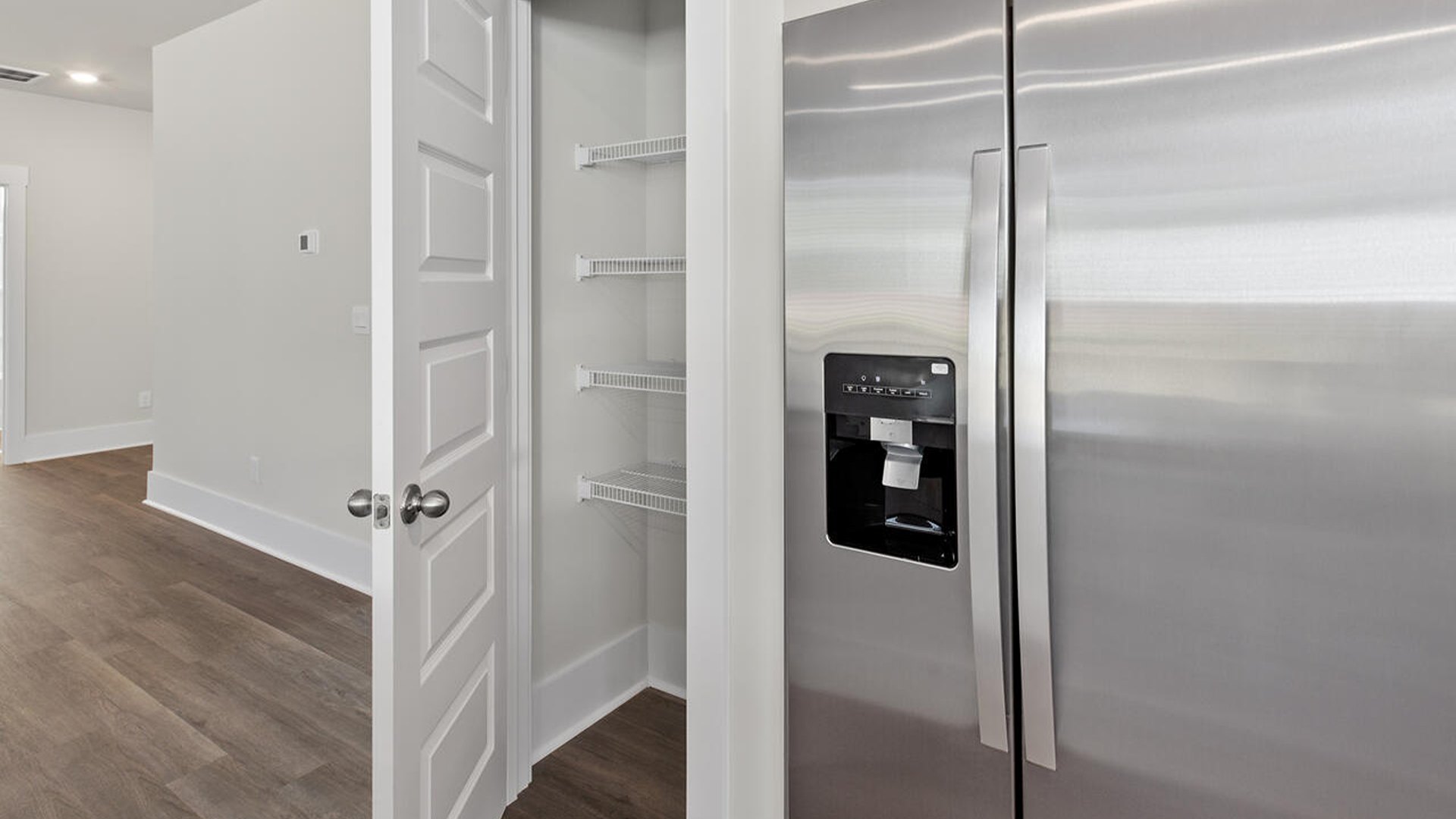 The kitchen features 36" cabinets, granite countertops, and stainless steel appliances, which are sure to both turn heads and make meal prep easy. You’ll never be too far from the action with the living and dining area right there.