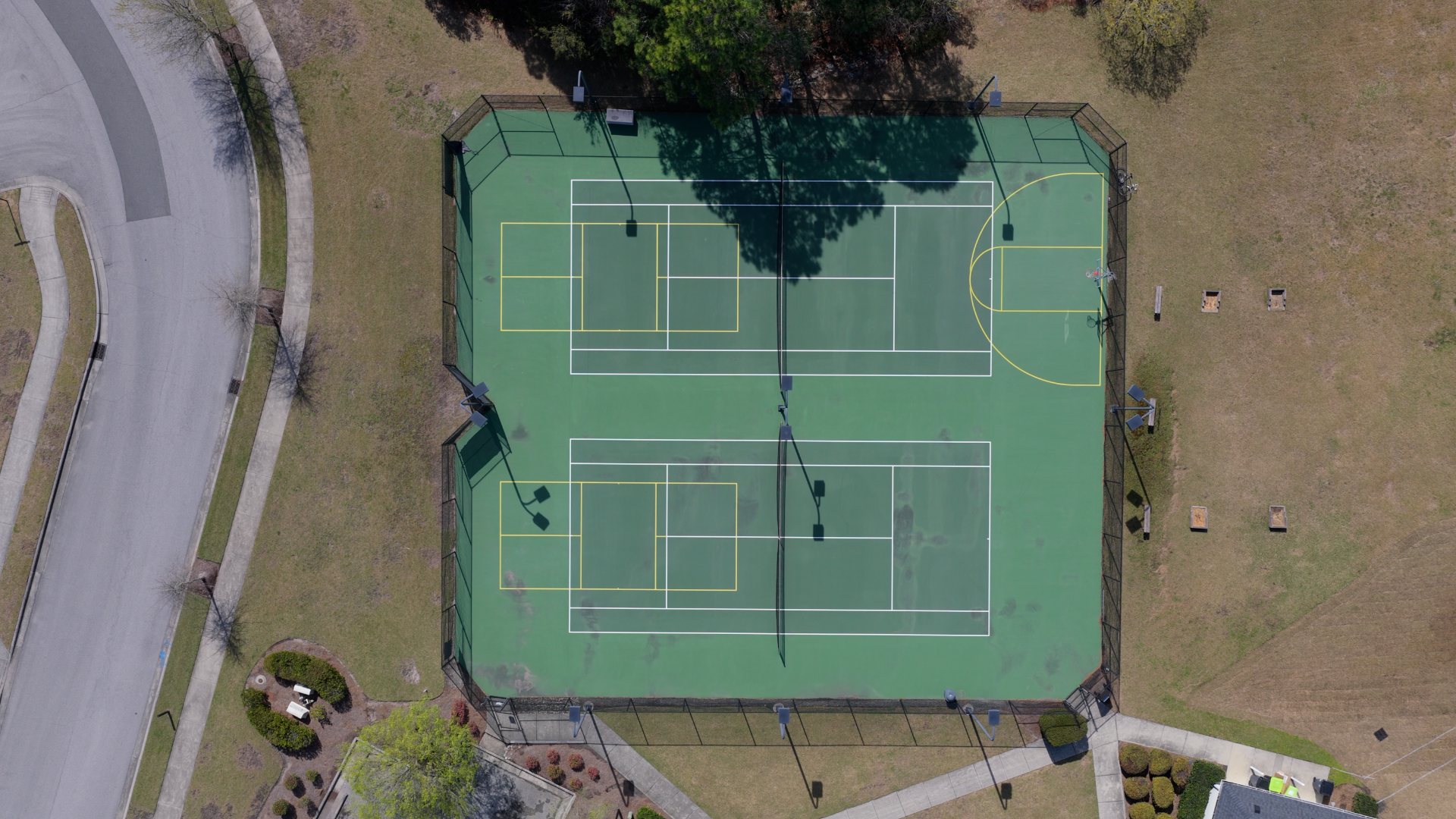 Residents have access to a range of amenities such as a well-equipped clubhouse, a fitness room, a spacious competition swimming pool, a kiddie pool, a hot tub, a sports court, a playground, and picturesque nature trails for walking.