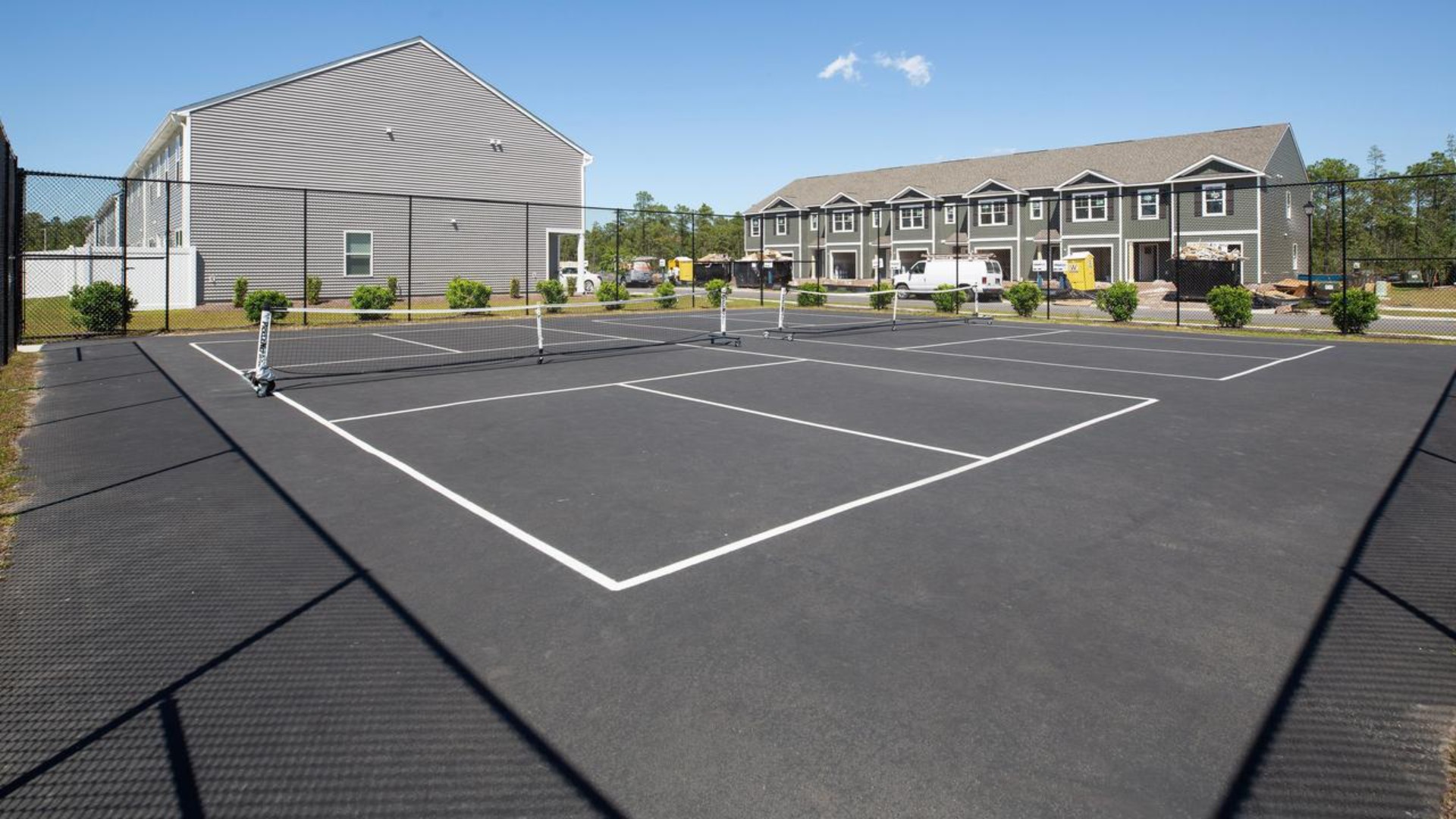 Residents have access to a range of amenities such as a well-equipped clubhouse, a fitness room, a spacious competition swimming pool, a kiddie pool, a hot tub, a sports court, a playground, and picturesque nature trails for walking.
