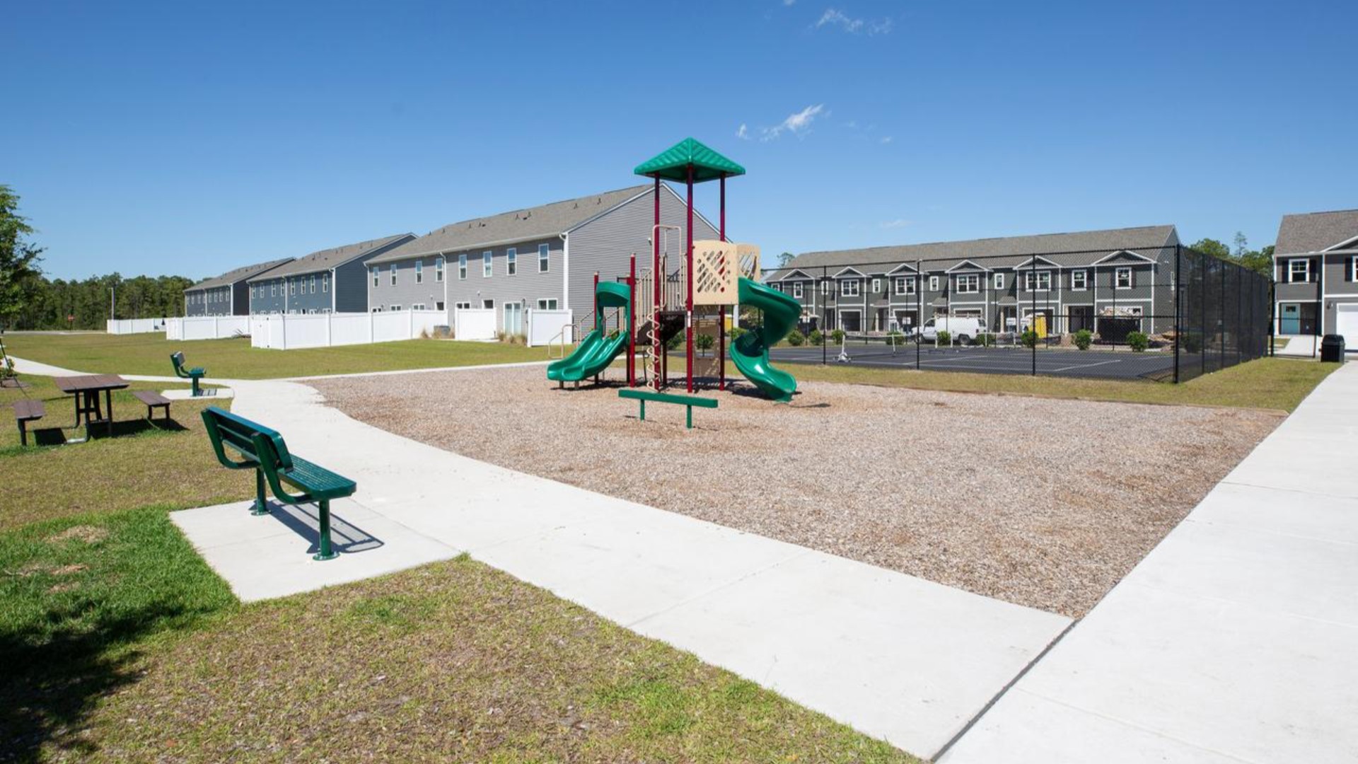 Residents have access to a range of amenities such as a well-equipped clubhouse, a fitness room, a spacious competition swimming pool, a kiddie pool, a hot tub, a sports court, a playground, and picturesque nature trails for walking.