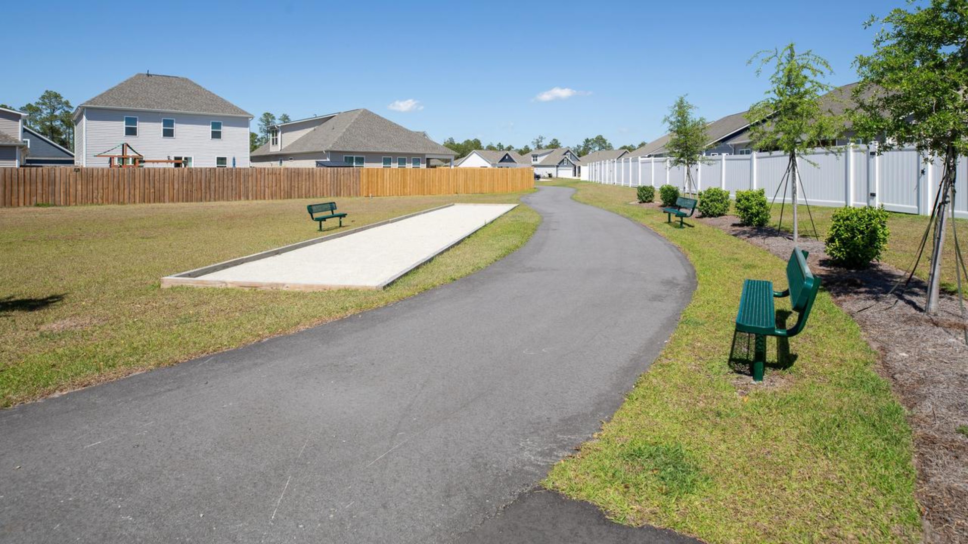 Residents have access to a range of amenities such as a well-equipped clubhouse, a fitness room, a spacious competition swimming pool, a kiddie pool, a hot tub, a sports court, a playground, and picturesque nature trails for walking.