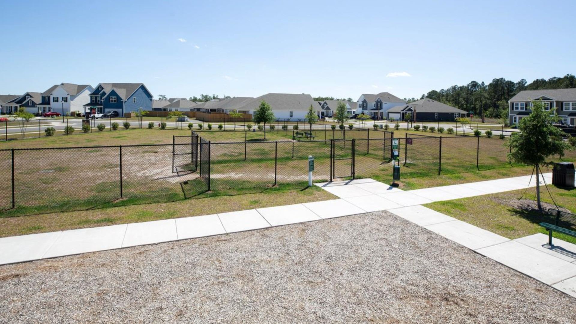 Residents have access to a range of amenities such as a well-equipped clubhouse, a fitness room, a spacious competition swimming pool, a kiddie pool, a hot tub, a sports court, a playground, and picturesque nature trails for walking.