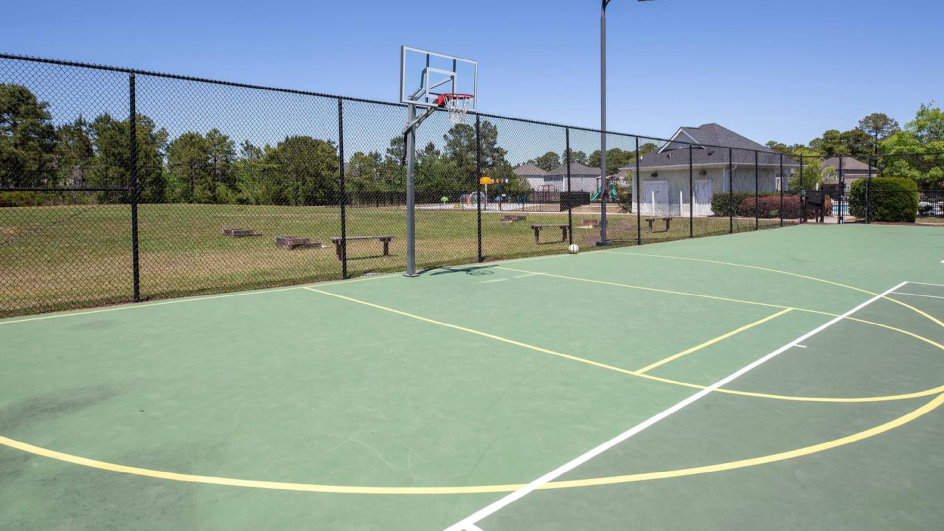 Residents have access to a range of amenities such as a well-equipped clubhouse, a fitness room, a spacious competition swimming pool, a kiddie pool, a hot tub, a sports court, a playground, and picturesque nature trails for walking.