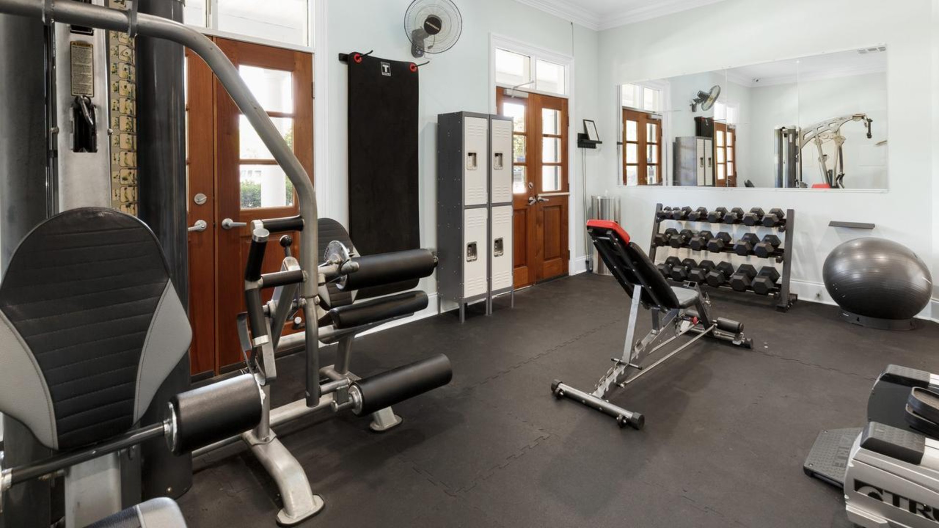 Residents have access to a range of amenities such as a well-equipped clubhouse, a fitness room, a spacious competition swimming pool, a kiddie pool, a hot tub, a sports court, a playground, and picturesque nature trails for walking.