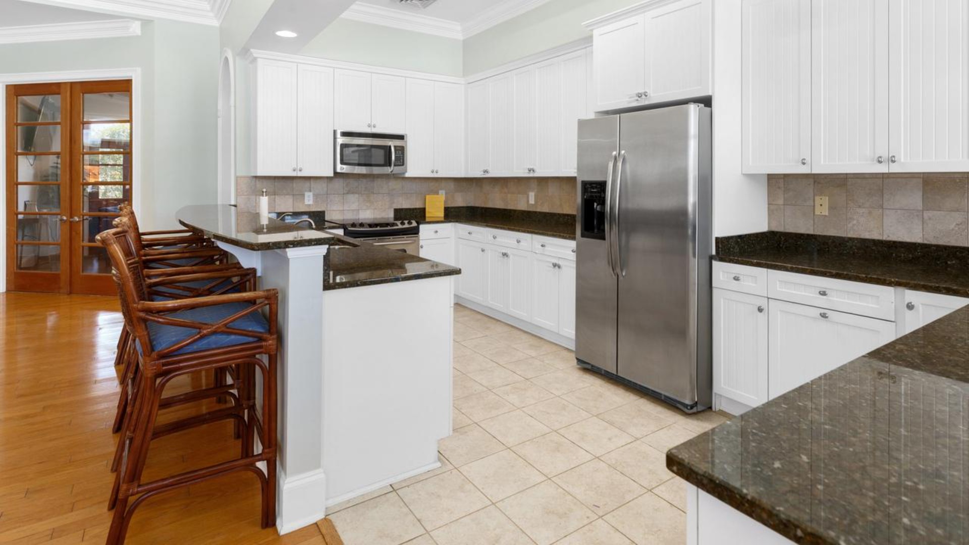 Residents have access to a range of amenities such as a well-equipped clubhouse, a fitness room, a spacious competition swimming pool, a kiddie pool, a hot tub, a sports court, a playground, and picturesque nature trails for walking.