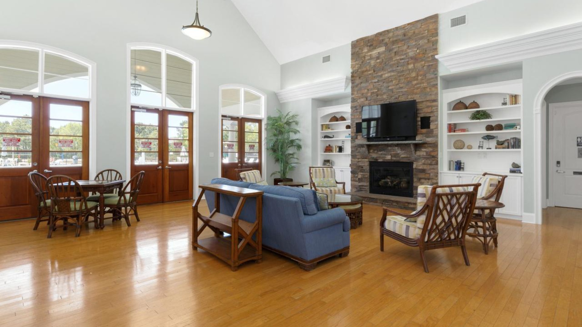 Residents have access to a range of amenities such as a well-equipped clubhouse, a fitness room, a spacious competition swimming pool, a kiddie pool, a hot tub, a sports court, a playground, and picturesque nature trails for walking.
