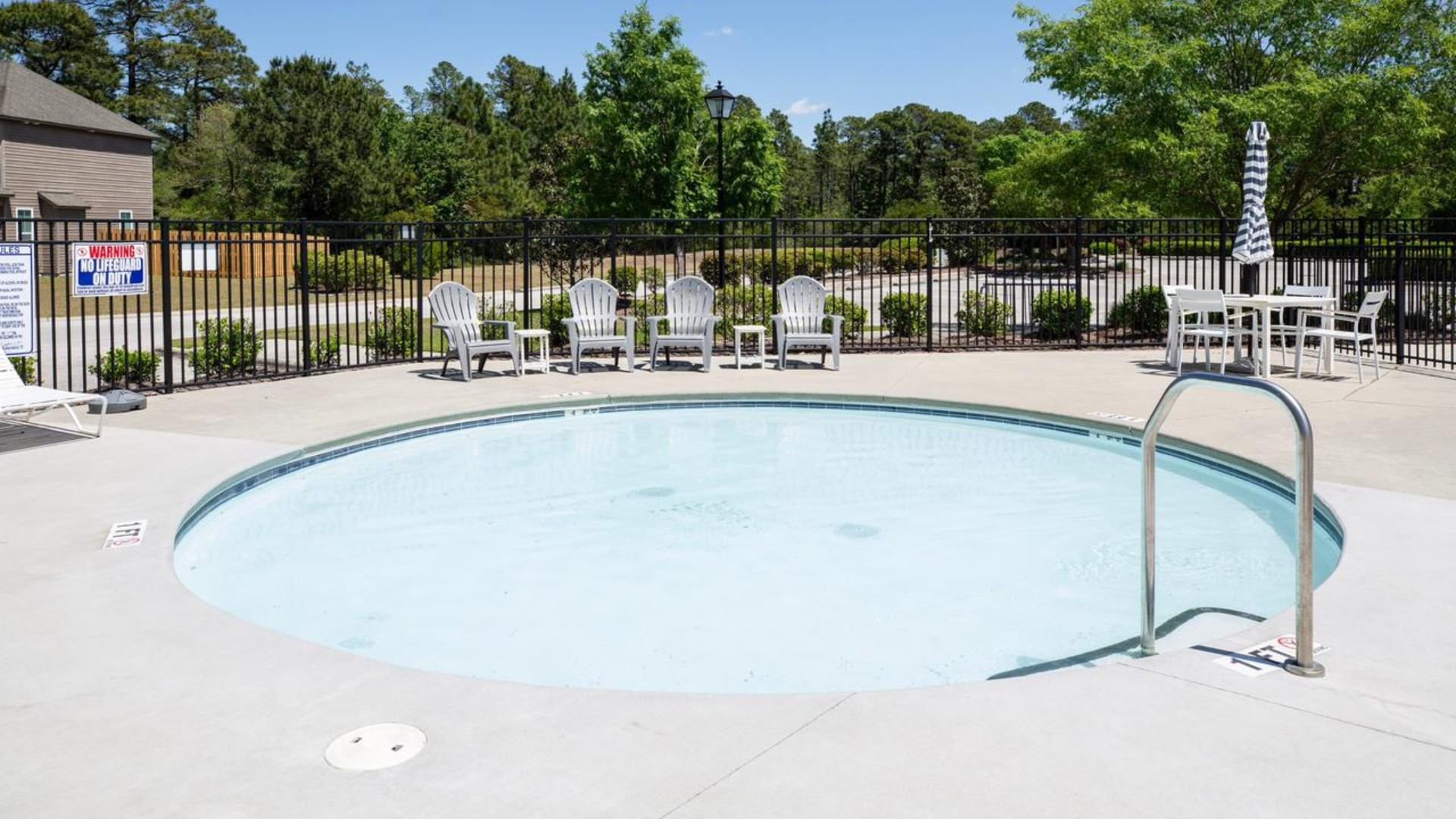 Residents have access to a range of amenities such as a well-equipped clubhouse, a fitness room, a spacious competition swimming pool, a kiddie pool, a hot tub, a sports court, a playground, and picturesque nature trails for walking.