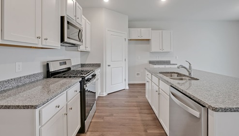 New Homes in Leland NC. Grayson Park. Amenities. pool. clubhouse. sport court. The Cali has an open concept living space which includes a fantastic kitchen featuring Stainless Steel Appliances