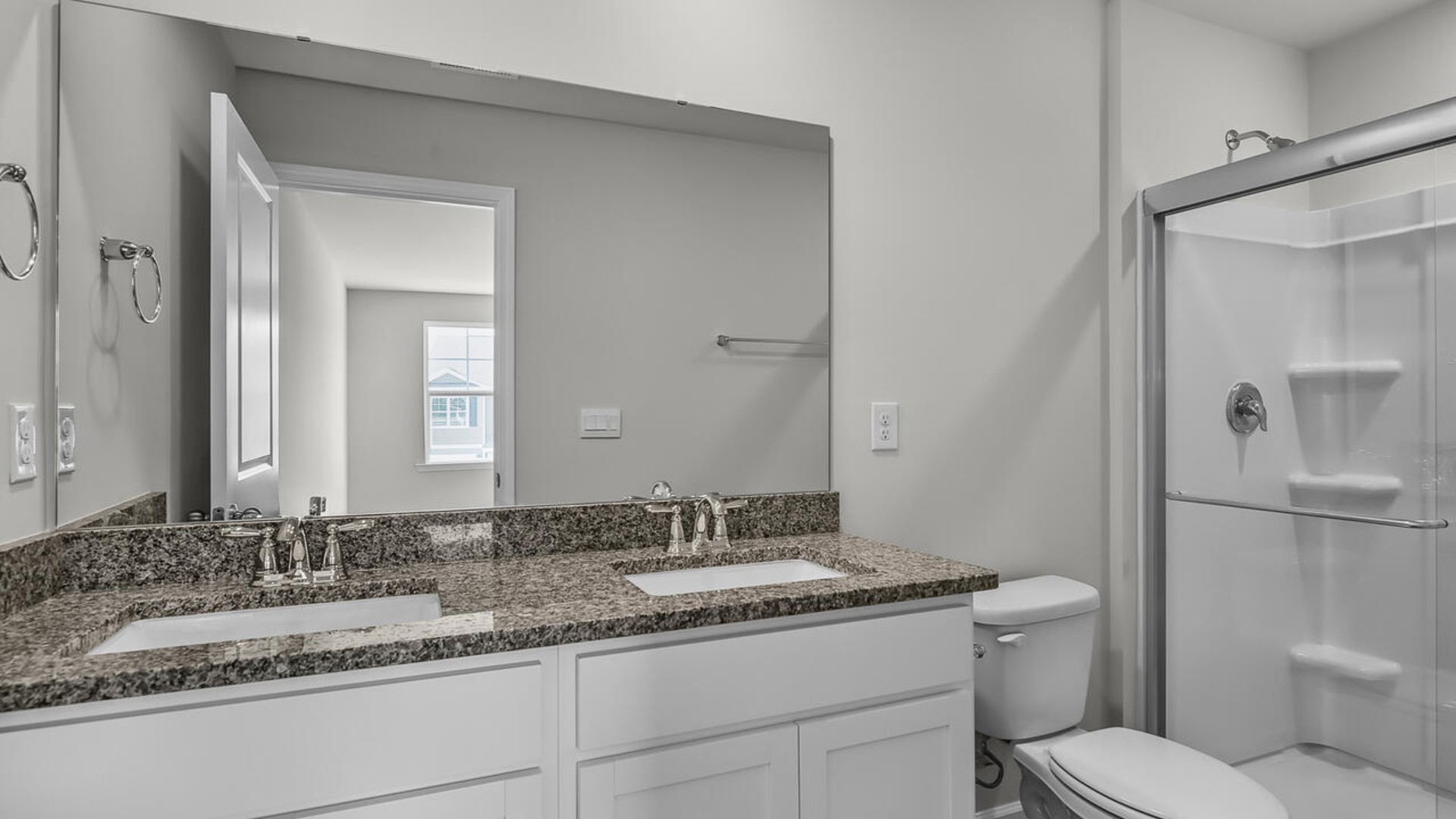 The second floor features the primary bedroom with a walk-in closet and double vanities. It