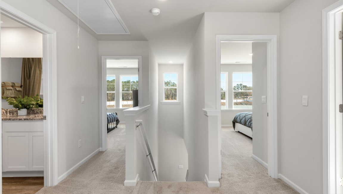 Upstairs, there are 3 more bedrooms, a shared bathroom and a loft area, adding to the flexibility of the layout. For those in search of a contemporary townhome with a functional layout, the Norman is an excellent choice.