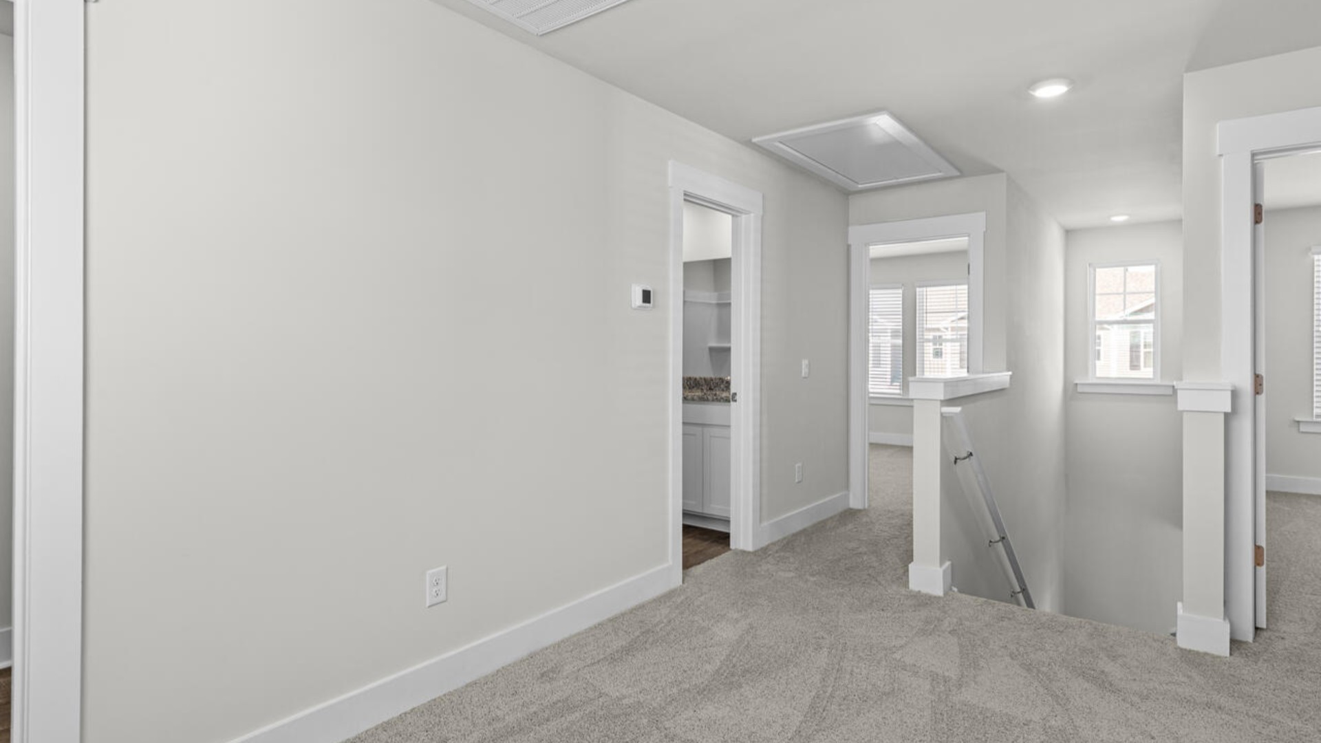 Upstairs, there are 3 more bedrooms, a shared bathroom and a loft area, adding to the flexibility of the layout. For those in search of a contemporary townhome with a functional layout, the Norman