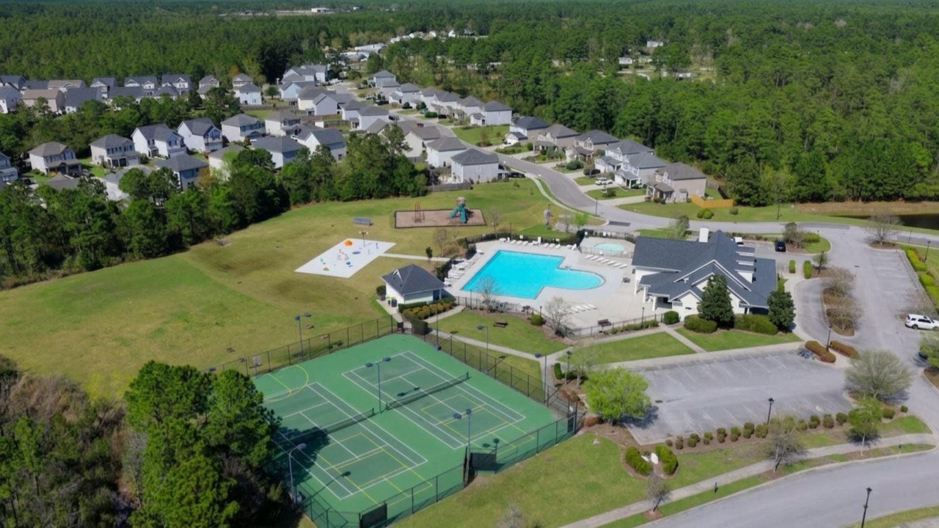 Residents have access to a range of amenities such as a well-equipped clubhouse, a fitness room, a spacious competition swimming pool, a kiddie pool, a hot tub, a sports court, a playground, and picturesque nature trails for walking.