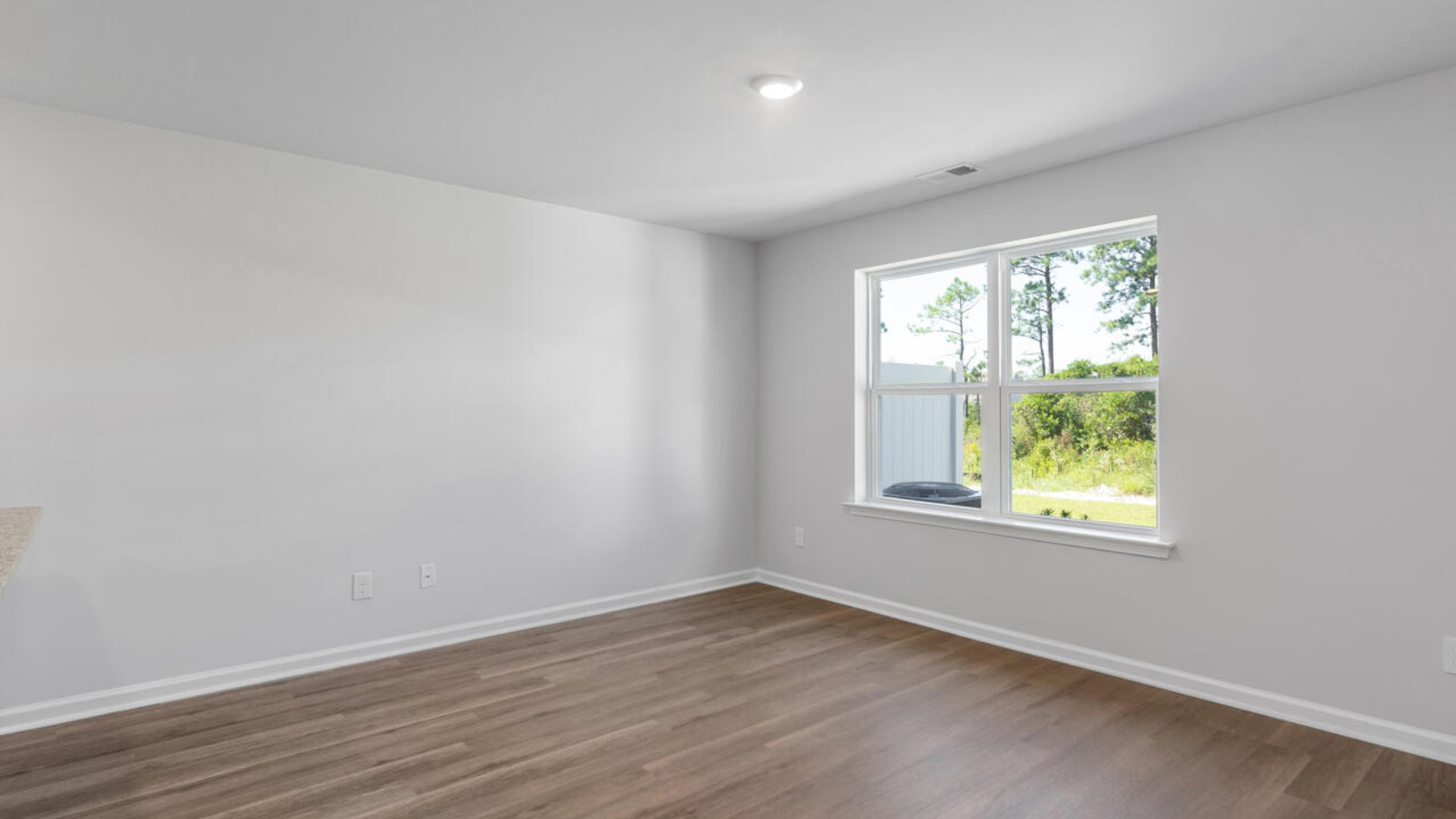 The kitchen overlooks the dining and living spaces, ideal for entertaining guests or enjoying family time while preparing meals with new stainless-steel appliances and Granite countertops.