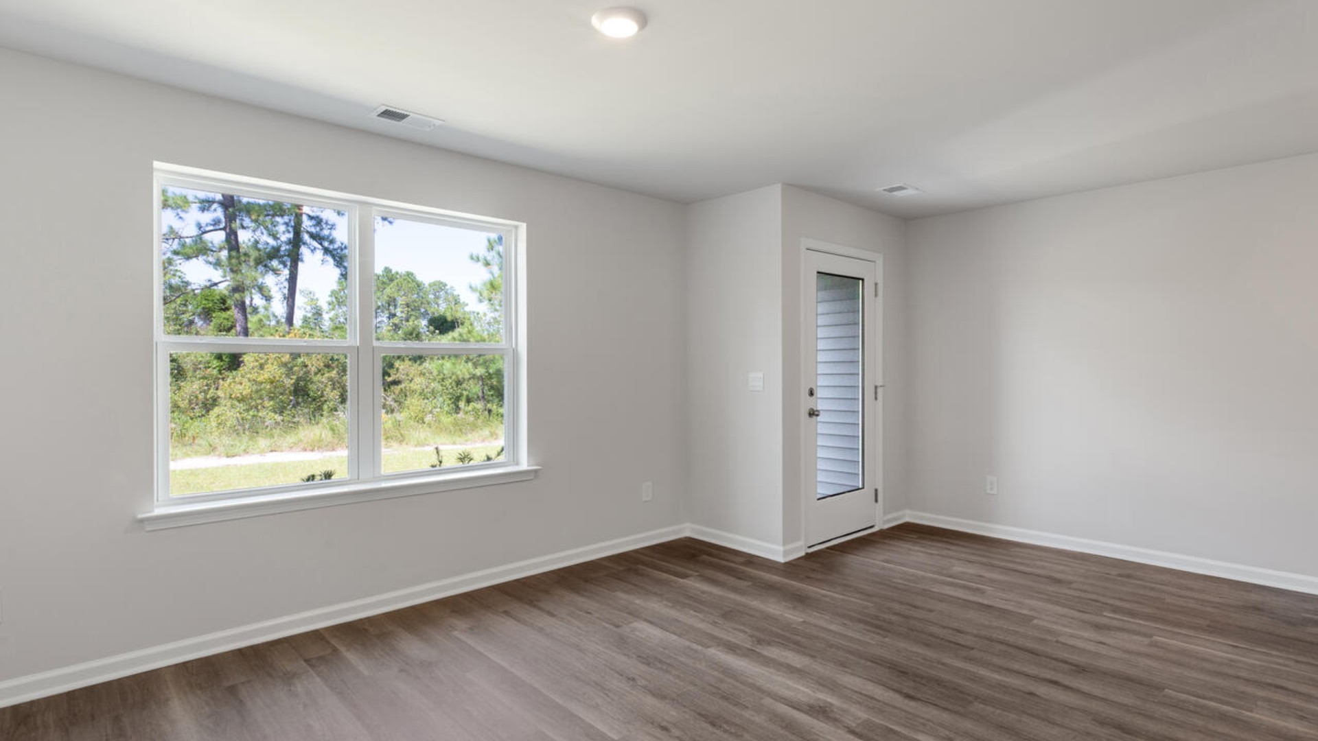 The kitchen overlooks the dining and living spaces, ideal for entertaining guests or enjoying family time while preparing meals with new stainless-steel appliances and Granite countertops.