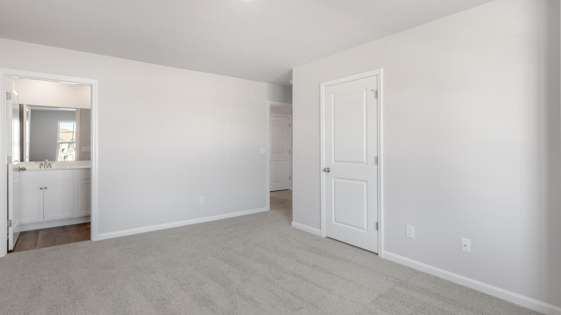 The second floor features the primary bedroom with a walk-in closet and double vanities.