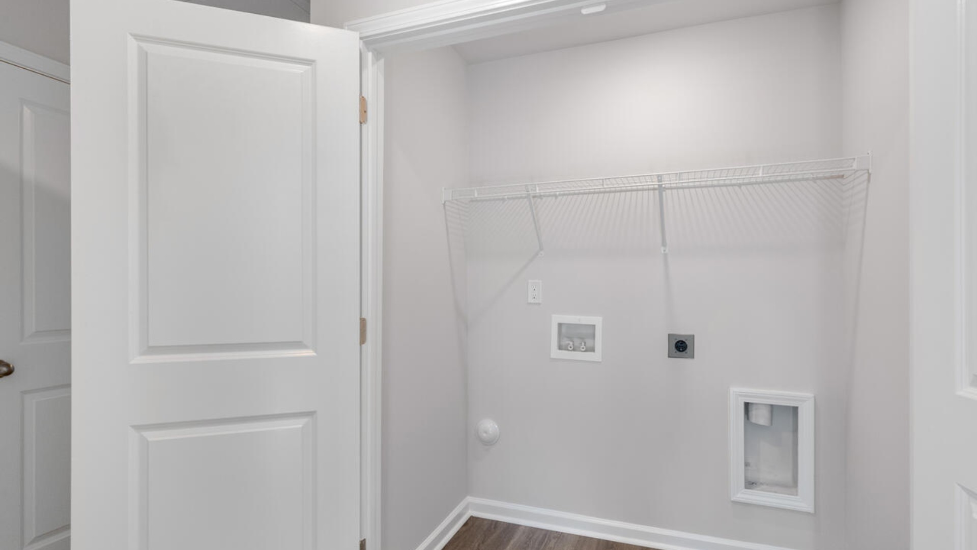 It also includes two additional bedrooms, a shared bathroom, and a laundry room for convenience. If