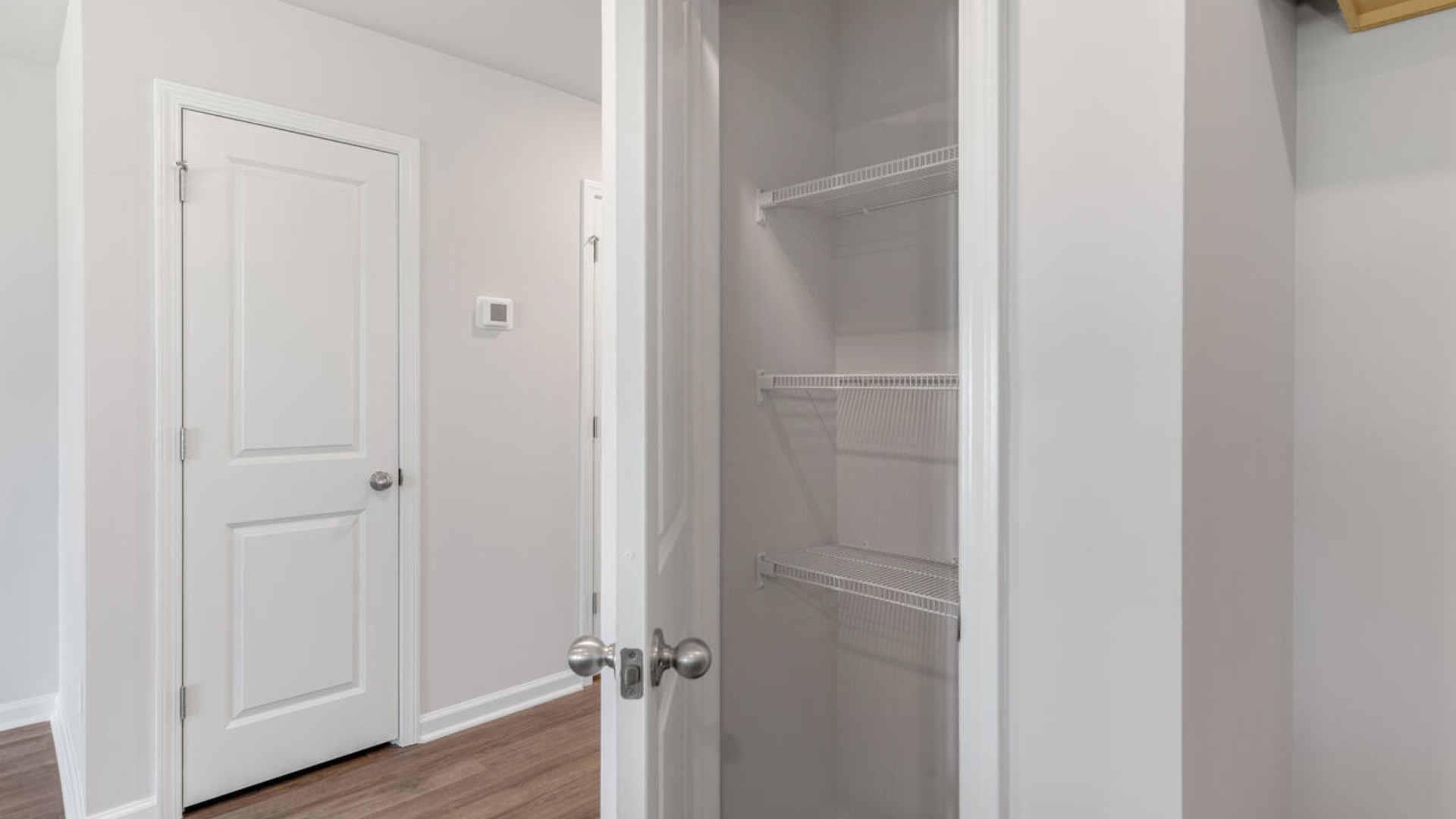 The kitchen overlooks the dining and living spaces, ideal for entertaining guests or enjoying family time while preparing meals with new stainless-steel appliances and Granite countertops.