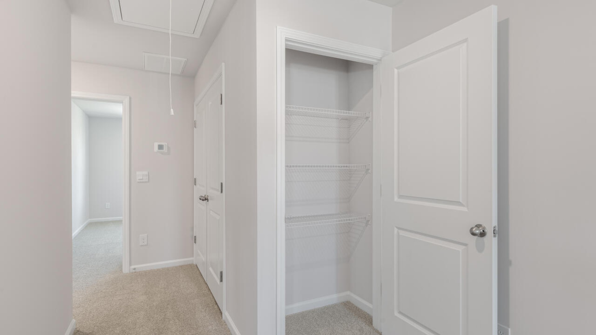 he second floor features the primary bedroom with a walk-in closet and double vanities.