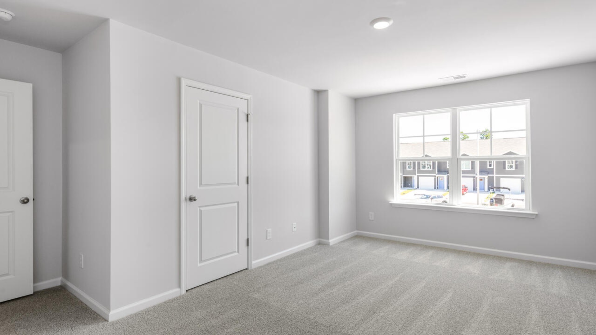 he second floor features the primary bedroom with a walk-in closet and double vanities.