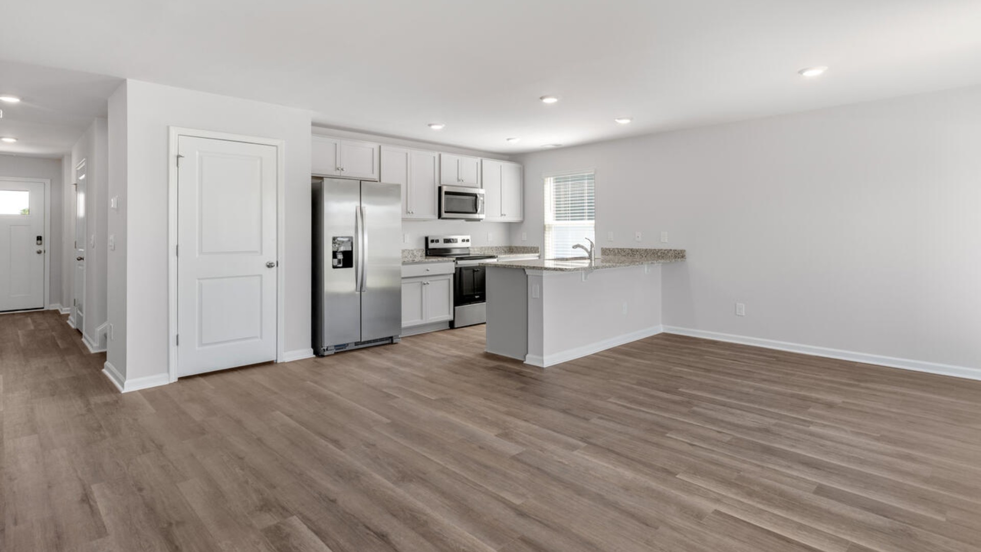 Your new Mitchell features an open concept first floor anchored by a spacious kitchen with a peninsula bar that overlooks your family and dining room. Y