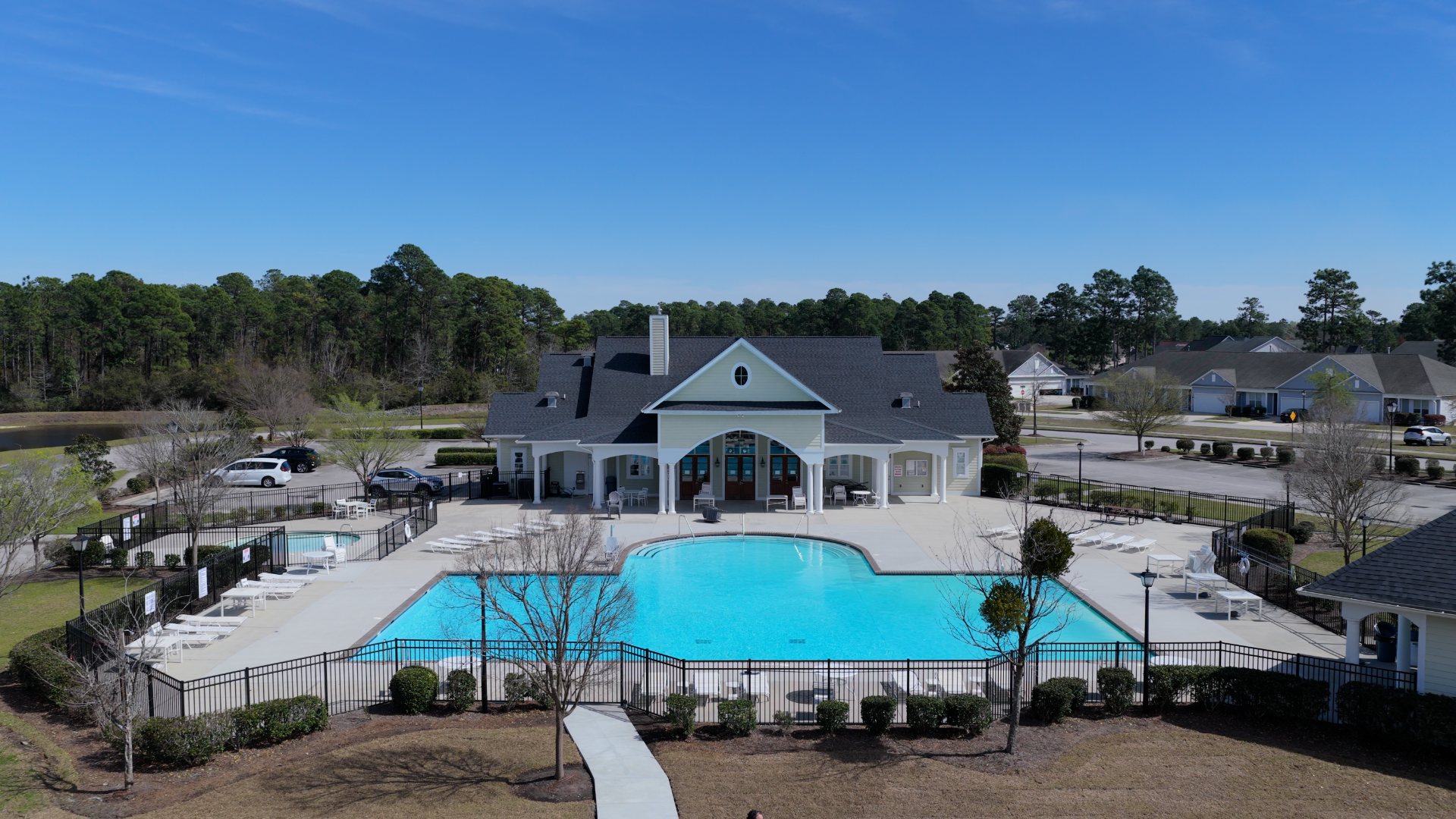 Homeowners have access to a range of amenities such as a well-equipped clubhouse, a fitness room, a spacious competition swimming pool, splashpad, a kiddie pool, a hot tub, a sports court, a playground, and picturesque nature trails for walking.
