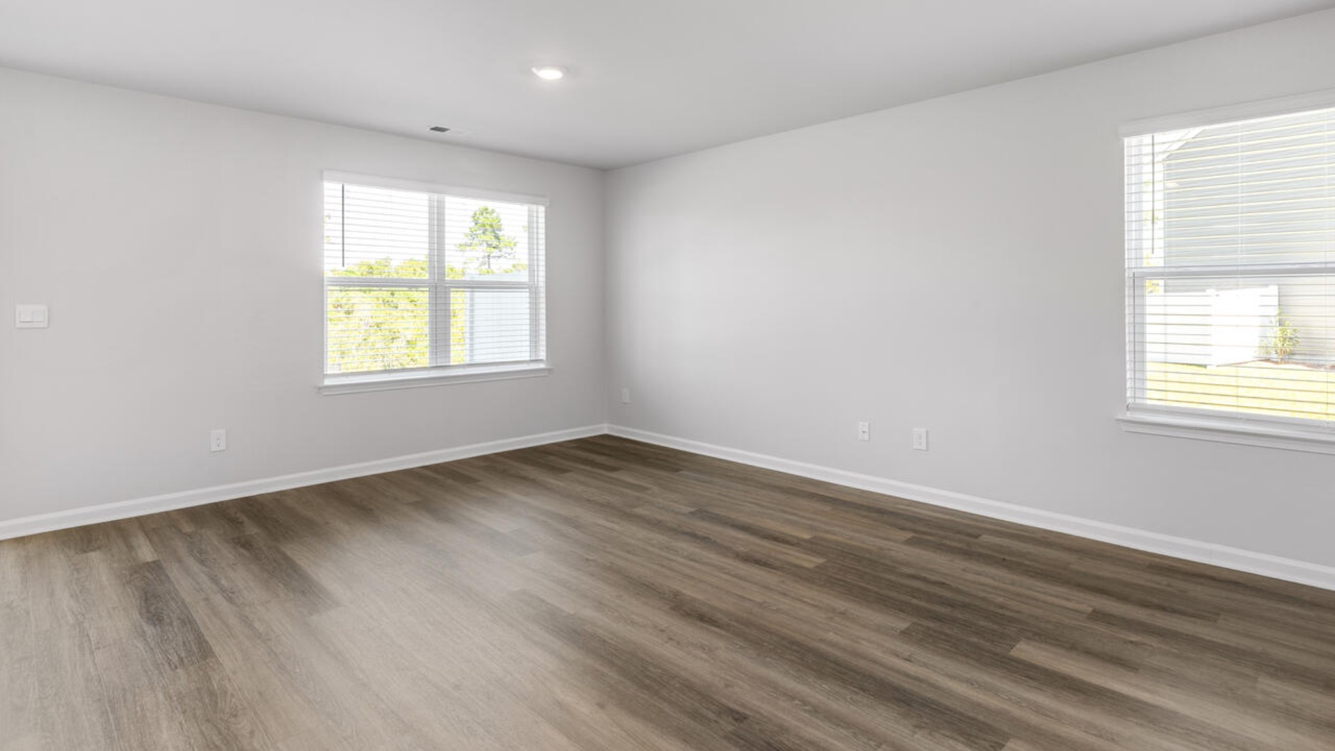 The kitchen features shaker-style cabinets, granite countertops, and stainless steel appliances, which are sure to both turn heads and make meal prep easy. You’ll never be too far from the action with the living and dining area right there.