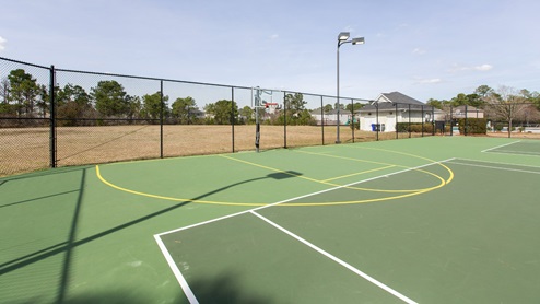 Residents have access to a range of amenities such as a well-equipped clubhouse, a fitness room, a spacious competition swimming pool, a kiddie pool, a hot tub, a sports court, a playground, and picturesque nature trails for walking.