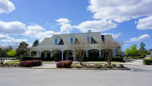 Residents have access to a range of amenities such as a well-equipped clubhouse, a fitness room, a spacious competition swimming pool, a kiddie pool, a hot tub, a sports court, a playground, and picturesque nature trails for walking.