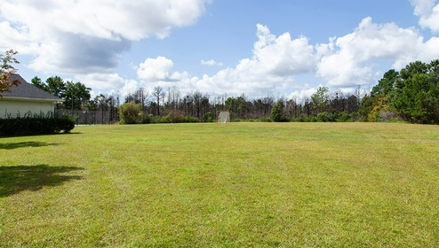 Residents have access to a range of amenities such as a well-equipped clubhouse, a fitness room, a spacious competition swimming pool, a kiddie pool, a hot tub, a sports court, a playground, and picturesque nature trails for walking.