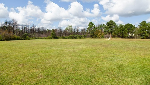 Residents have access to a range of amenities such as a well-equipped clubhouse, a fitness room, a spacious competition swimming pool, a kiddie pool, a hot tub, a sports court, a playground, and picturesque nature trails for walking.