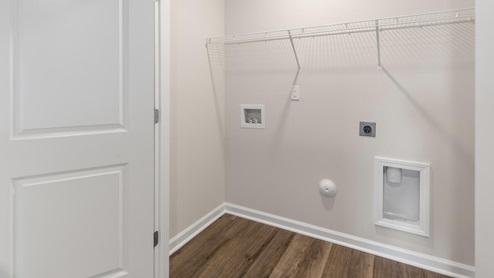 Upstairs, the primary bedroom has a walk-in closet and double vanities