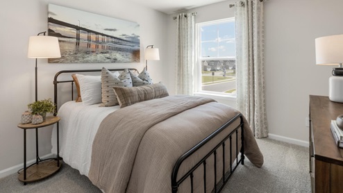 two additional bedrooms, a shared bathroom, and a laundry room.