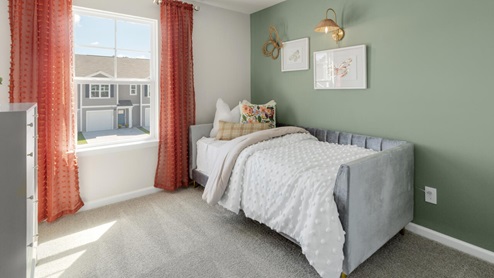 two additional bedrooms, a shared bathroom, and a laundry room.