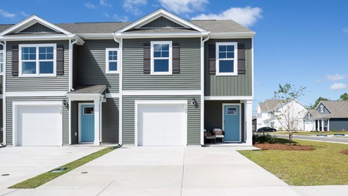 The Mitchell is a two-story townhome featuring 4 bedrooms, 2.5 baths. The first floor offers a spacious kitchen that opens into an airy living area