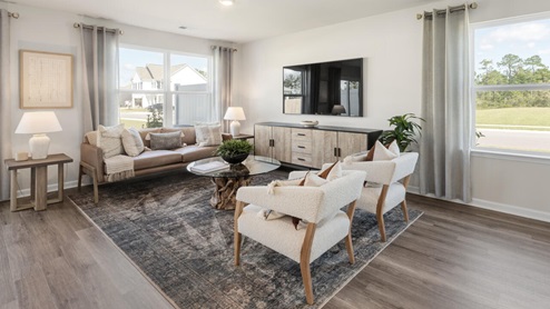 The Mitchell is a two-story townhome featuring 4 bedrooms, 2.5 baths. The first floor offers a spacious kitchen that opens into an airy living area, ideal for entertaining.