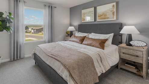 Upstairs, the primary bedroom has a walk-in closet and double vanities