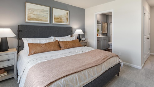 Upstairs, the primary bedroom has a walk-in closet and double vanities
