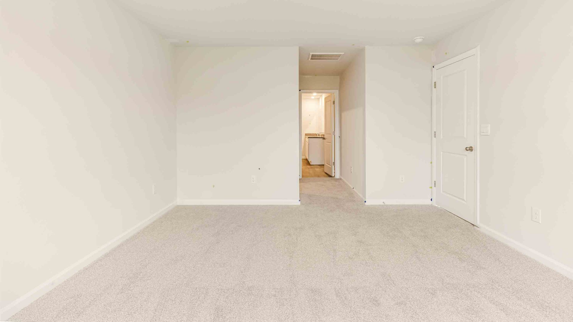 The primary suite is tucked away in the back of the home, offering a peaceful retreat complete with a walk-in shower, granite vanity, and a roomy walk-in closet.