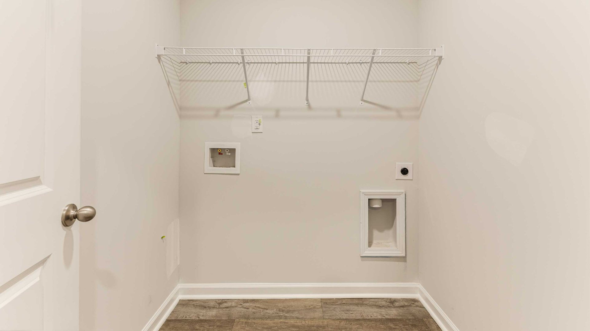 The primary suite is tucked away in the back of the home, offering a peaceful retreat complete with a walk-in shower, granite vanity, and a roomy walk-in closet.