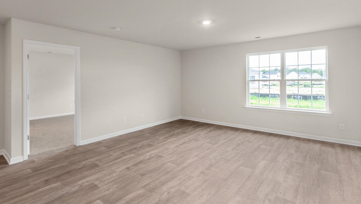 Need privacy? The primary suite is tucked away in the back of the home, offering a peaceful retreat complete with a walk-in shower, granite vanity, and a roomy walk-in closet. Three additional bedrooms are located up front- perfect for guests, kids, or a home office setup.  And don't forge