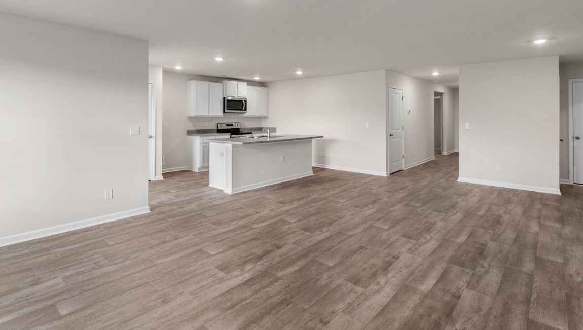 Need privacy? The primary suite is tucked away in the back of the home, offering a peaceful retreat complete with a walk-in shower, granite vanity, and a roomy walk-in closet. Three additional bedrooms are located up front- perfect for guests, kids, or a home office setup.  And don't forge