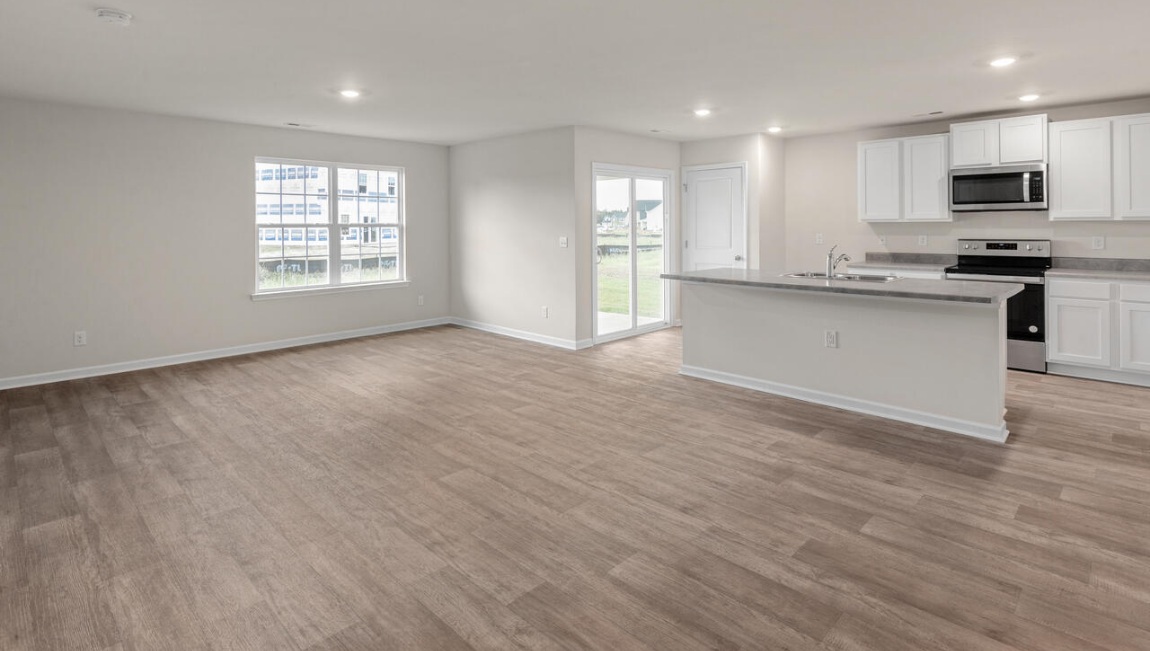 Need privacy? The primary suite is tucked away in the back of the home, offering a peaceful retreat complete with a walk-in shower, granite vanity, and a roomy walk-in closet. Three additional bedrooms are located up front- perfect for guests, kids, or a home office setup.  And don't forge