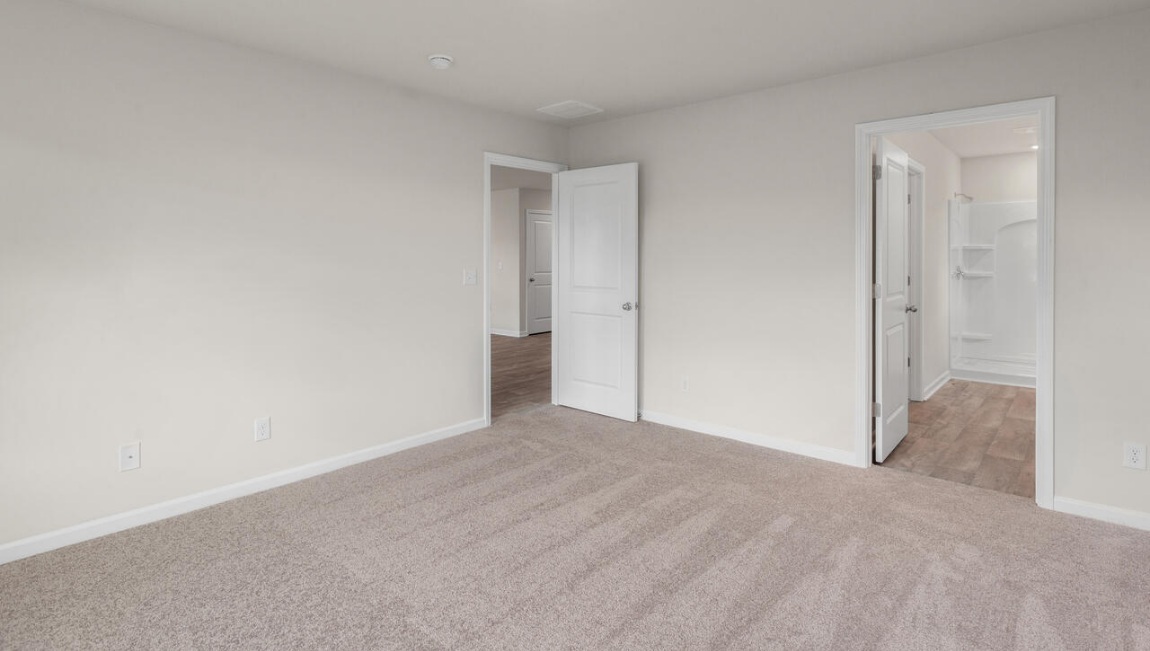 Need privacy? The primary suite is tucked away in the back of the home, offering a peaceful retreat complete with a walk-in shower, granite vanity, and a roomy walk-in closet. Three additional bedrooms are located up front- perfect for guests, kids, or a home office setup.  And don't forge